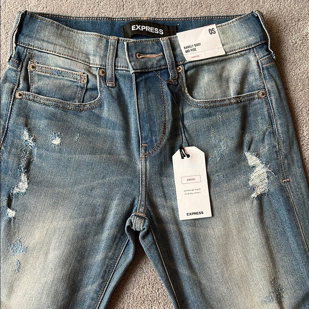 Express Faded Blue Bootcut Jeans.